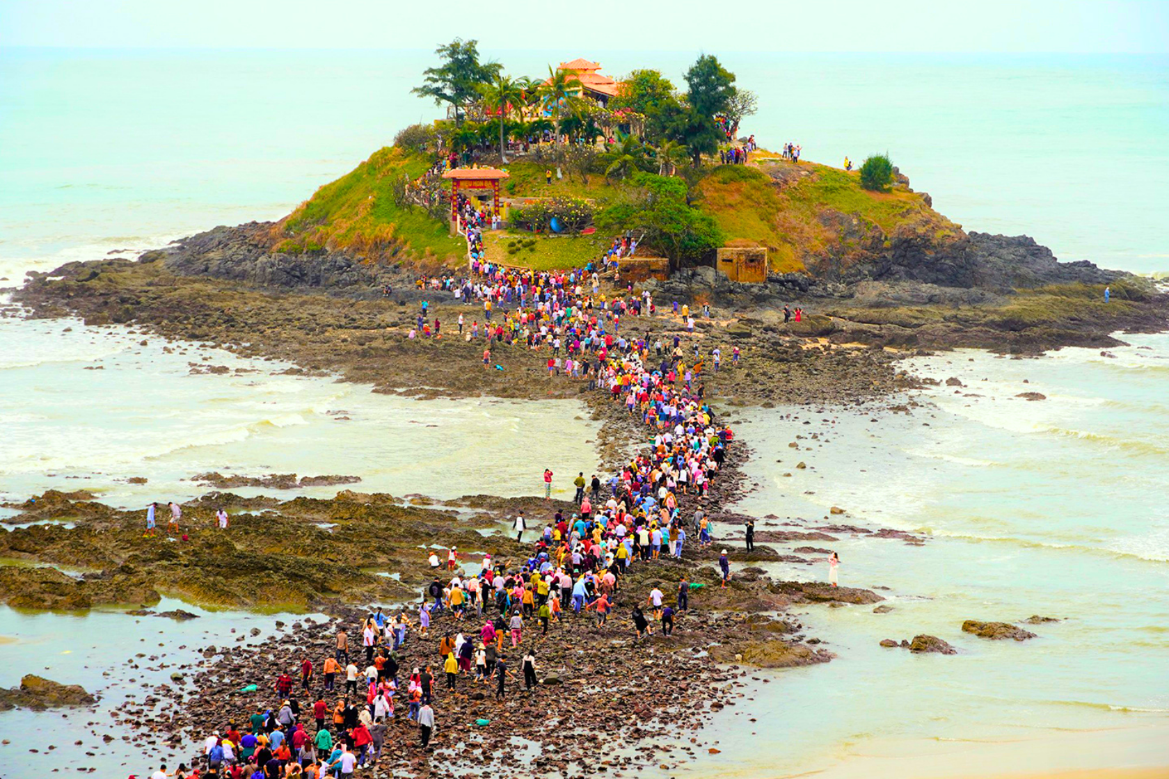 A procession makes its way to Hon Ba Islet in Vung Tau to attend the Lady of Five Elements Temple Festival.